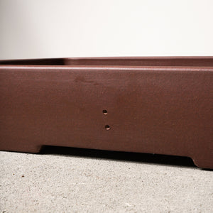 14" wide Xiying clay bonsai pot on a concrete surface with a neutral background.