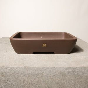 12" wide Xiying clay bonsai pot on a concrete surface with a neutral background.