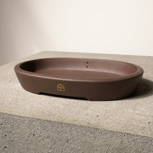 14" wide Xiying clay bonsai pot on a concrete surface with a neutral background.