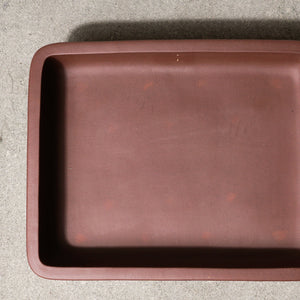 14" wide Xiying clay bonsai pot on a concrete surface with a neutral background.