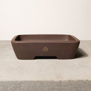10" wide Xiying clay bonsai pot on a concrete surface with a neutral background.